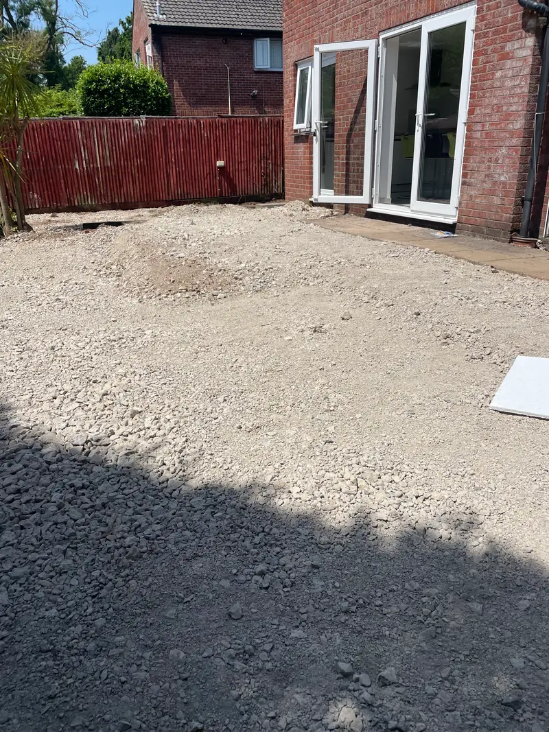 During the build: the garden fully excavated with a compacted stone sub-base laid before paving