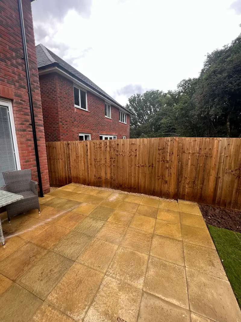 Golden sandstone patio with new fencing