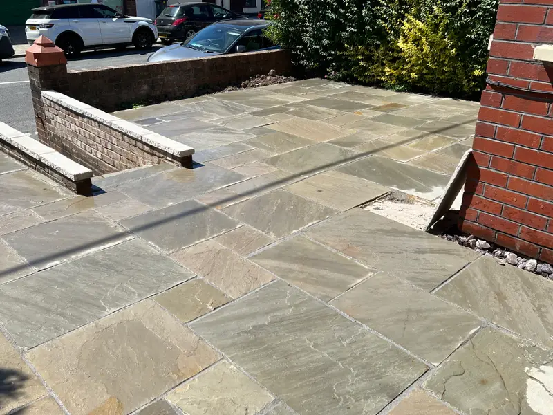 Sandstone patio with brick raised beds
